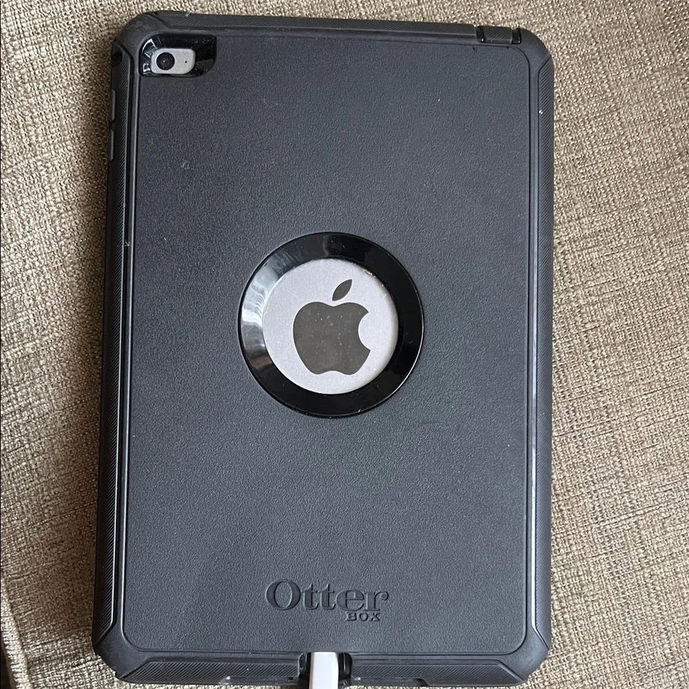 Apple IPad Mini with black otter box case